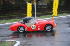 Entrant in TRIUMPH TR2 looking at measurement line in PC competition